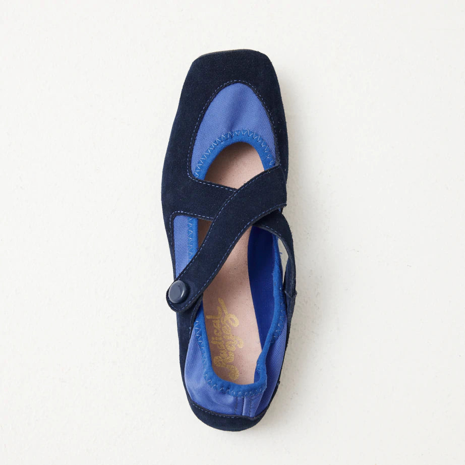 A soft, flexible ballet flat made from dark blue suede and comfortable blue neoprene.