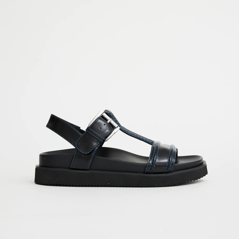 Women's summer T-Bar sandal in black leather with blue highlight stitching, silver buckle and arch support.