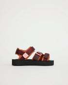 Mango and cherry sandal with multiple straps on a light gray background