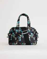 Floral printed navy bowling bag with a black crossbody strap