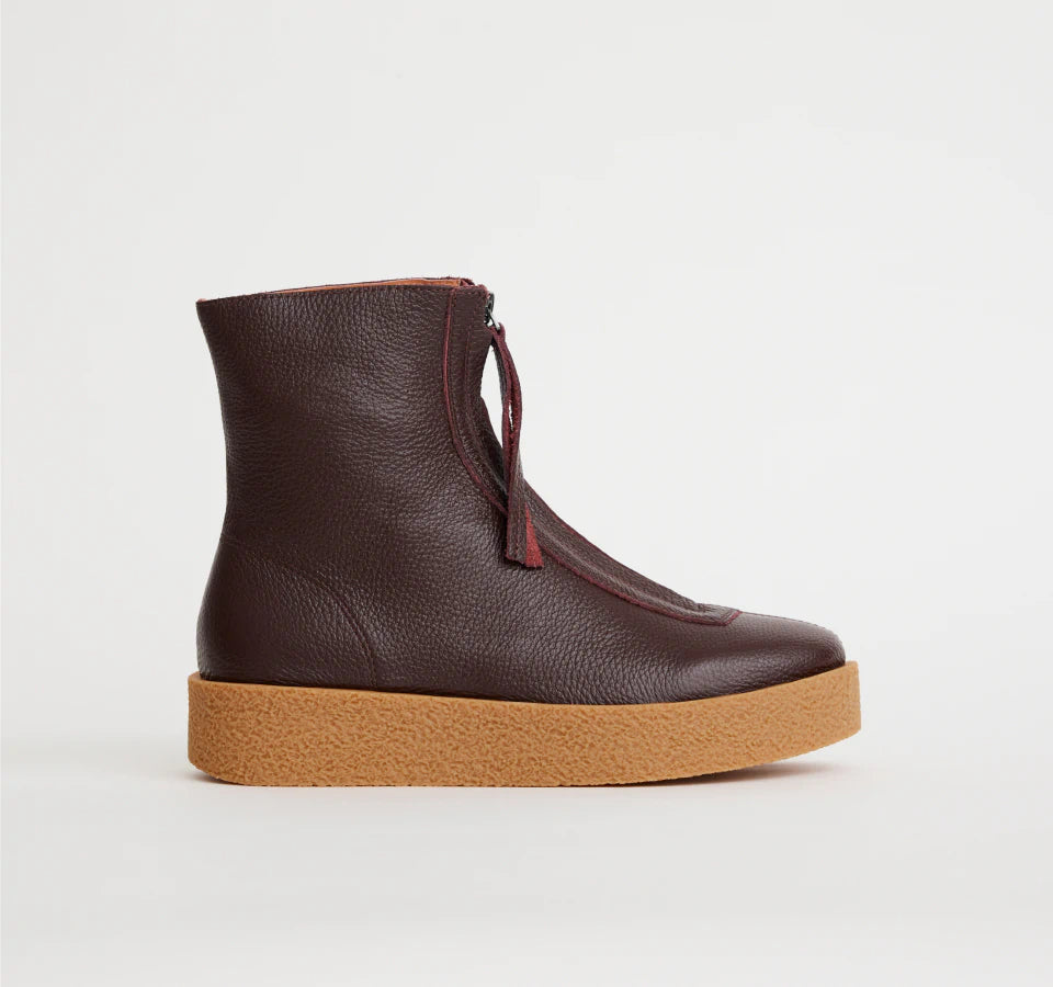 Zip up leather Lucent boot in Aubergine colour with natural coloured rubber outsole.