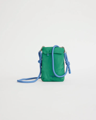 Green crossbody phone pouch with blue strap on a light gray background
