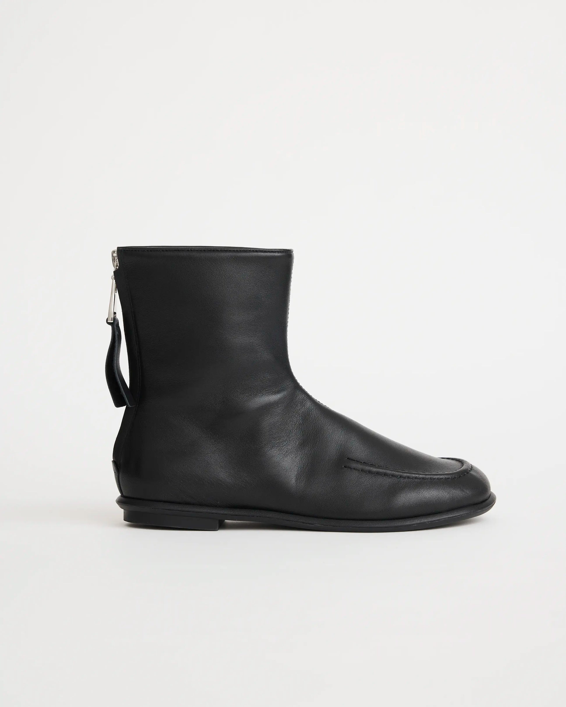 Black leather zip boot on a white background