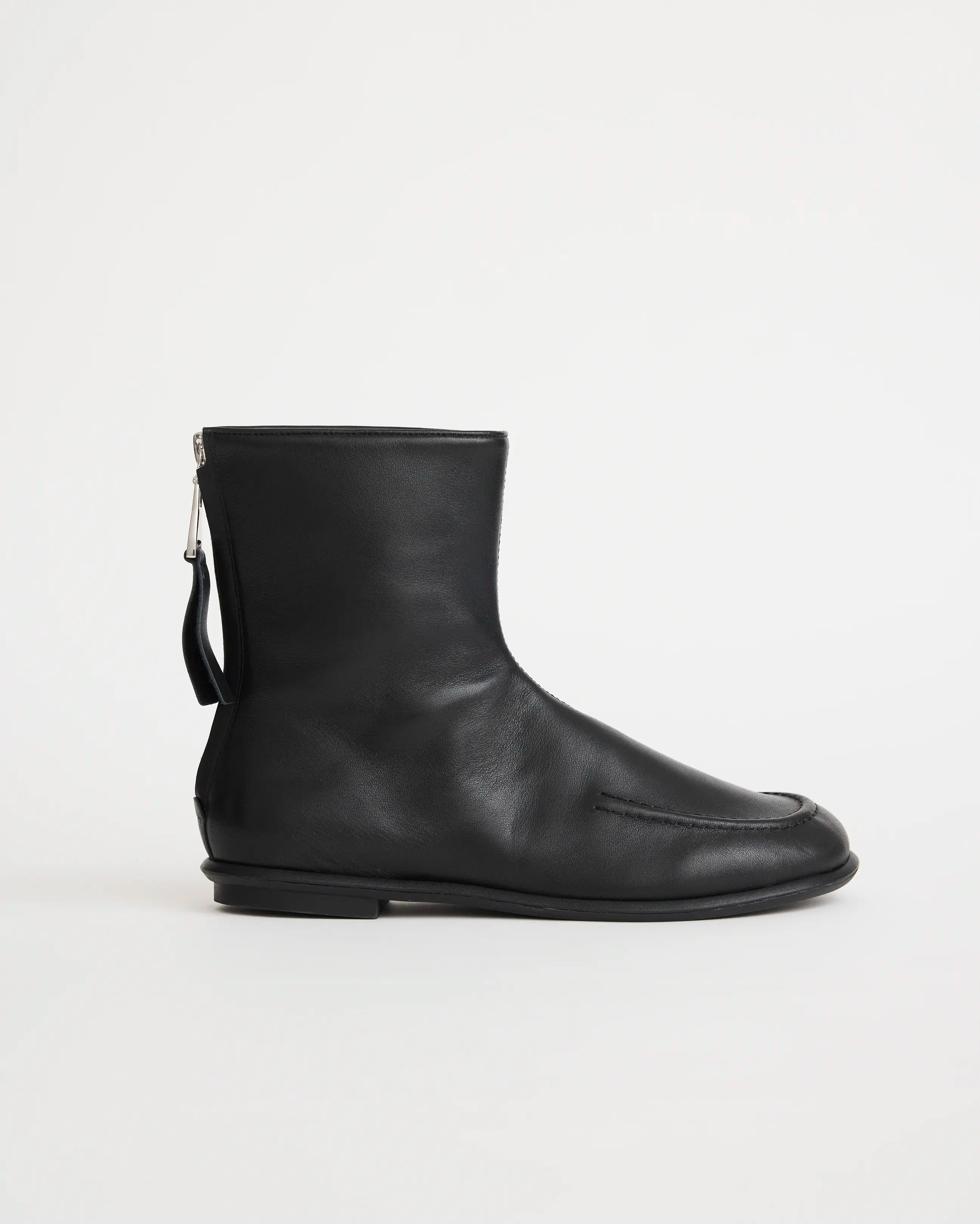 Black leather zip boot on a white background