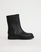 Black leather wool lined boot on a light gray background