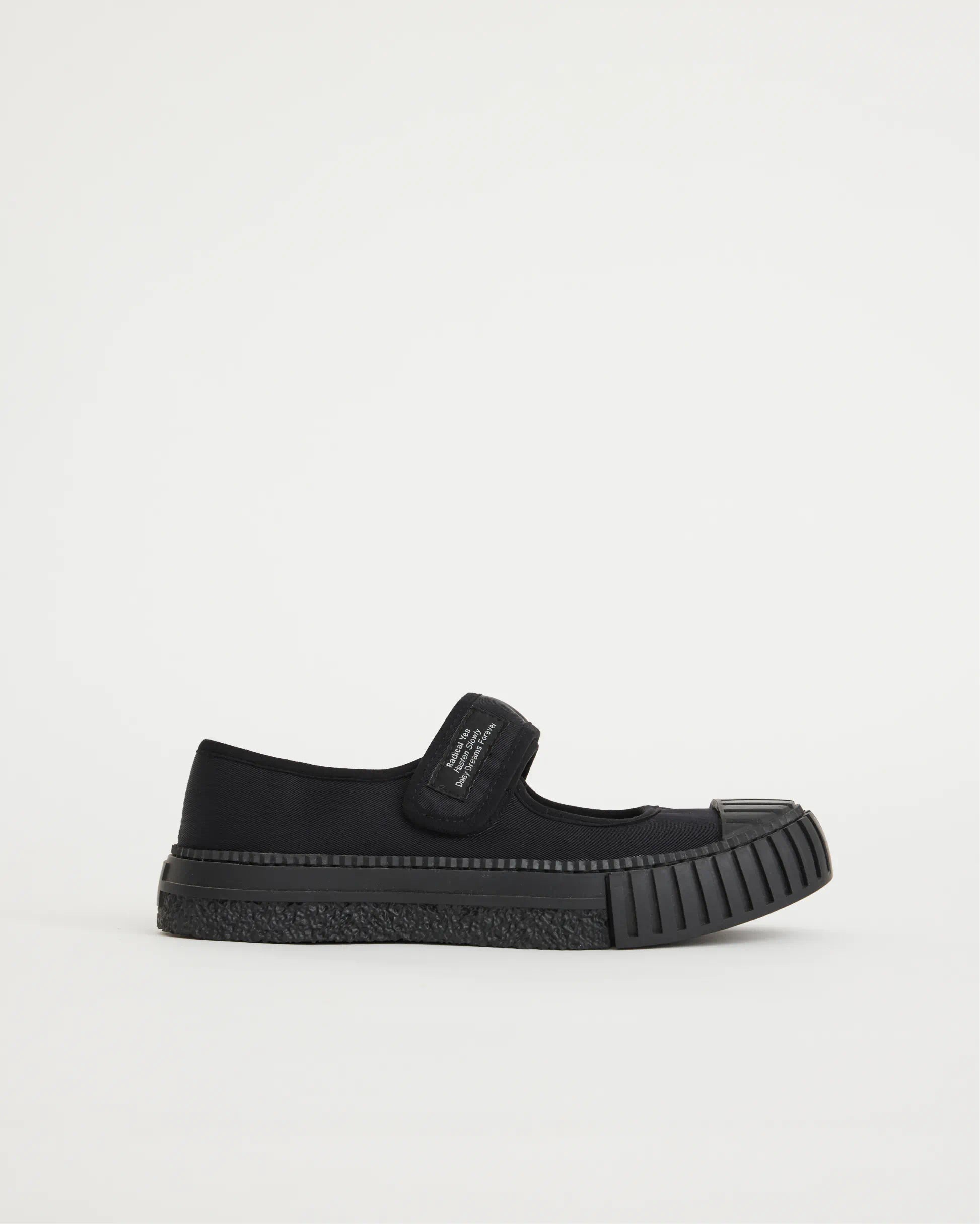 Black velcro mary jane on a light gray background