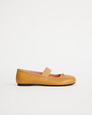 Yellow leather flat shoe on a white background