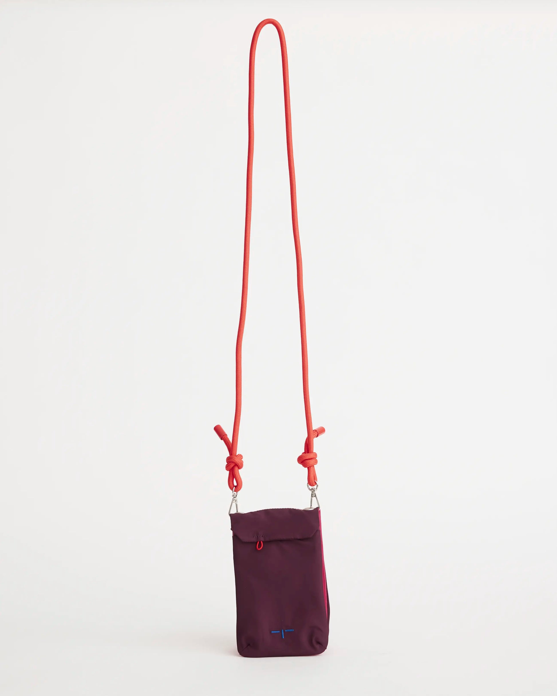 Purple pouch with an orange strap on a white background