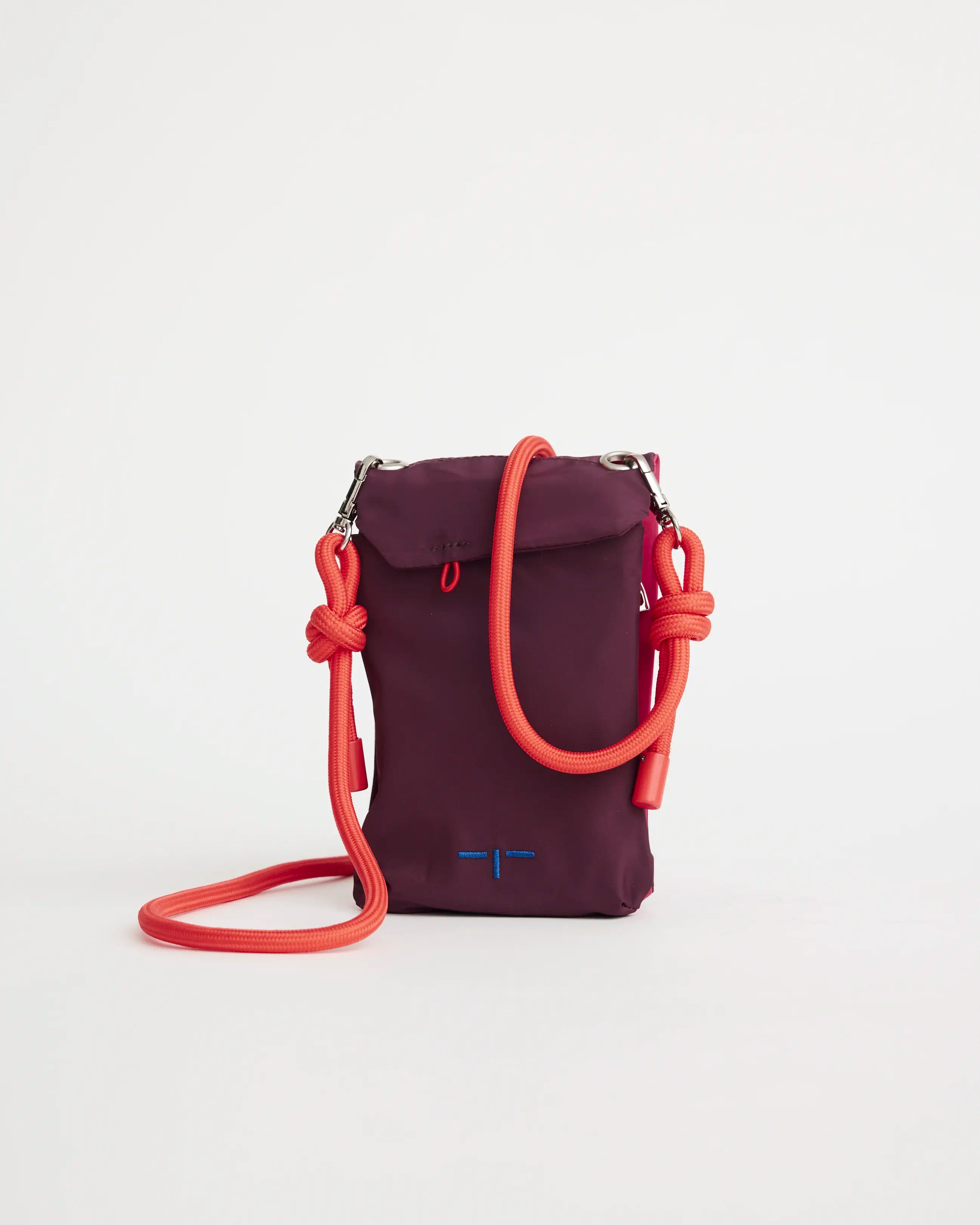 Purple phone pouch with a pink strap on a white background