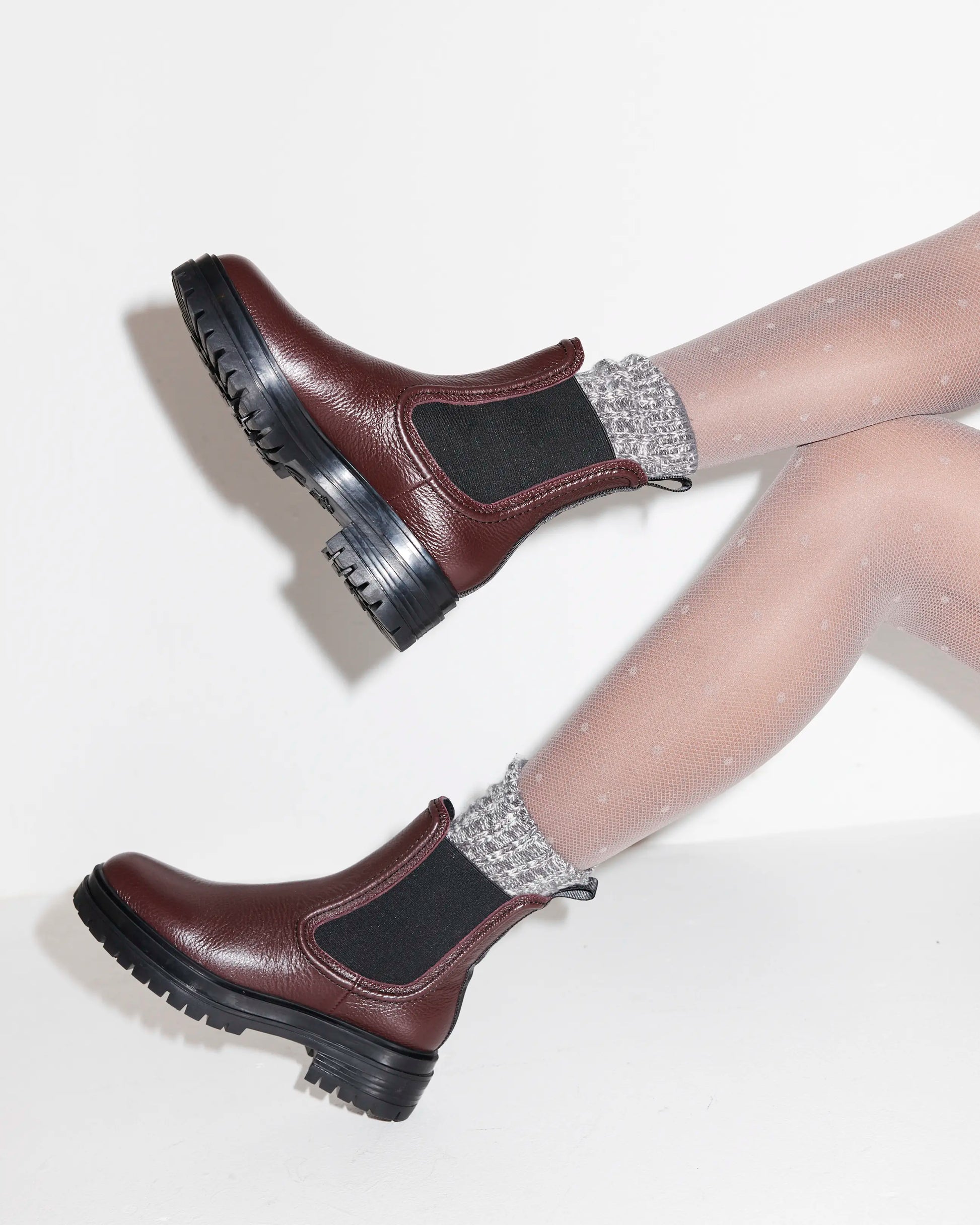 Purple leather Chelsea boots with black soles