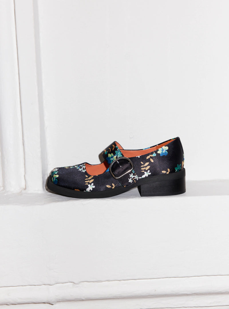 A floral printed satin mary jane with a silver buckle