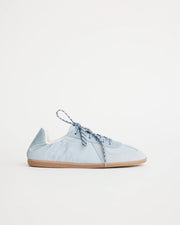 Light blue sneaker on a white background