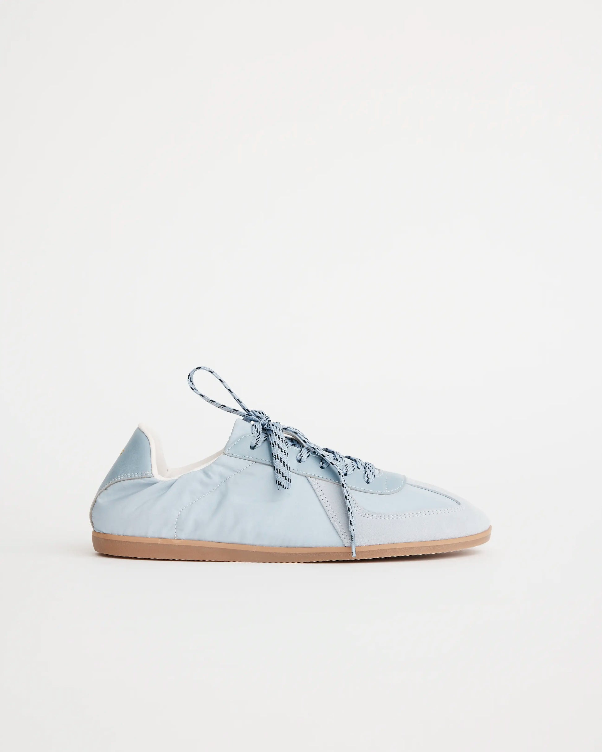 Light blue sneaker on a white background