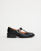 Black leather square toe shoe with silver buckle, peach lining and cut out details