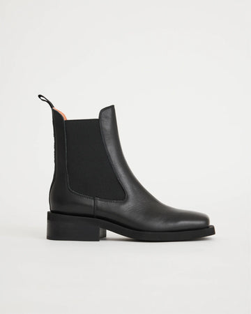 Black leather square toe chelsea boot with a black sole.