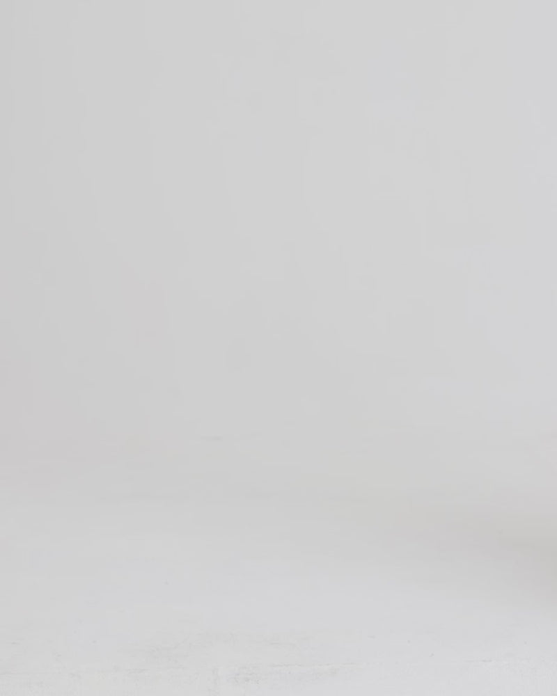 Person walking with a yellow handbag.