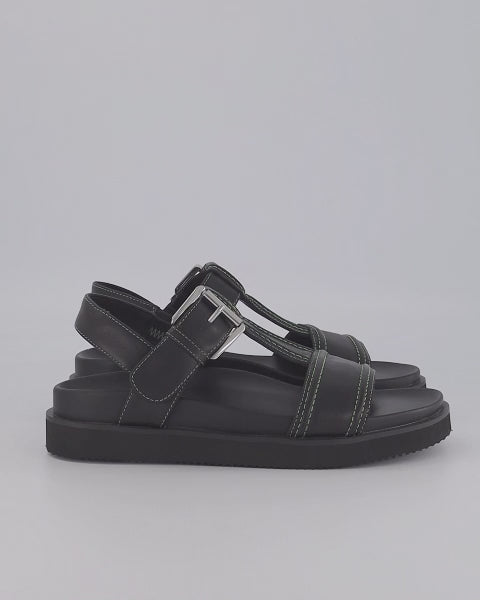 Load video: Visby T-Bar Sandal | Black leather with Green Topstitch
