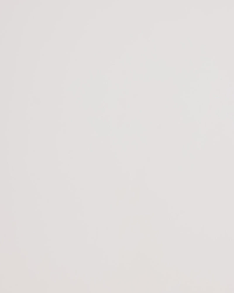 Person holding a floral patterned crossbody bowling bag