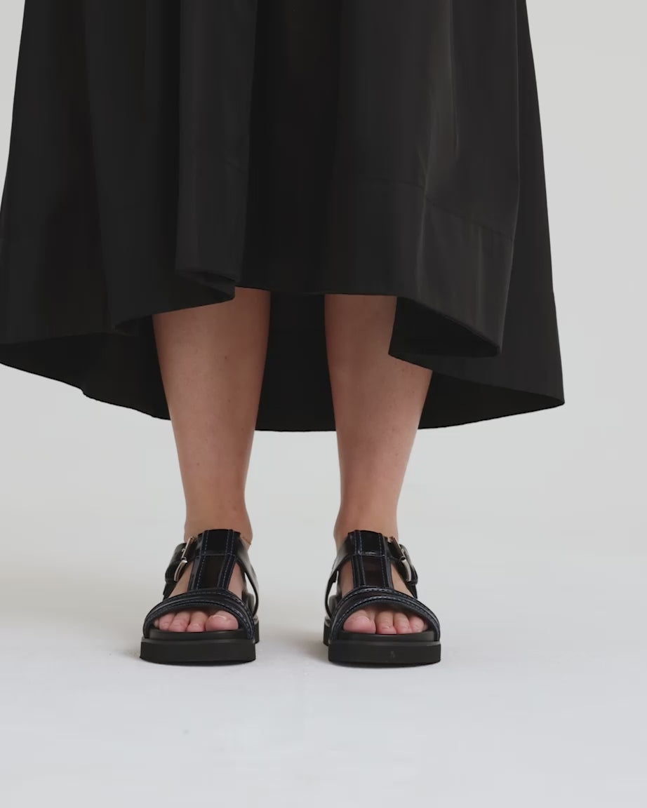 Load video: Visby T-Bar Sandal | Black with Sky Blue Top Stitch